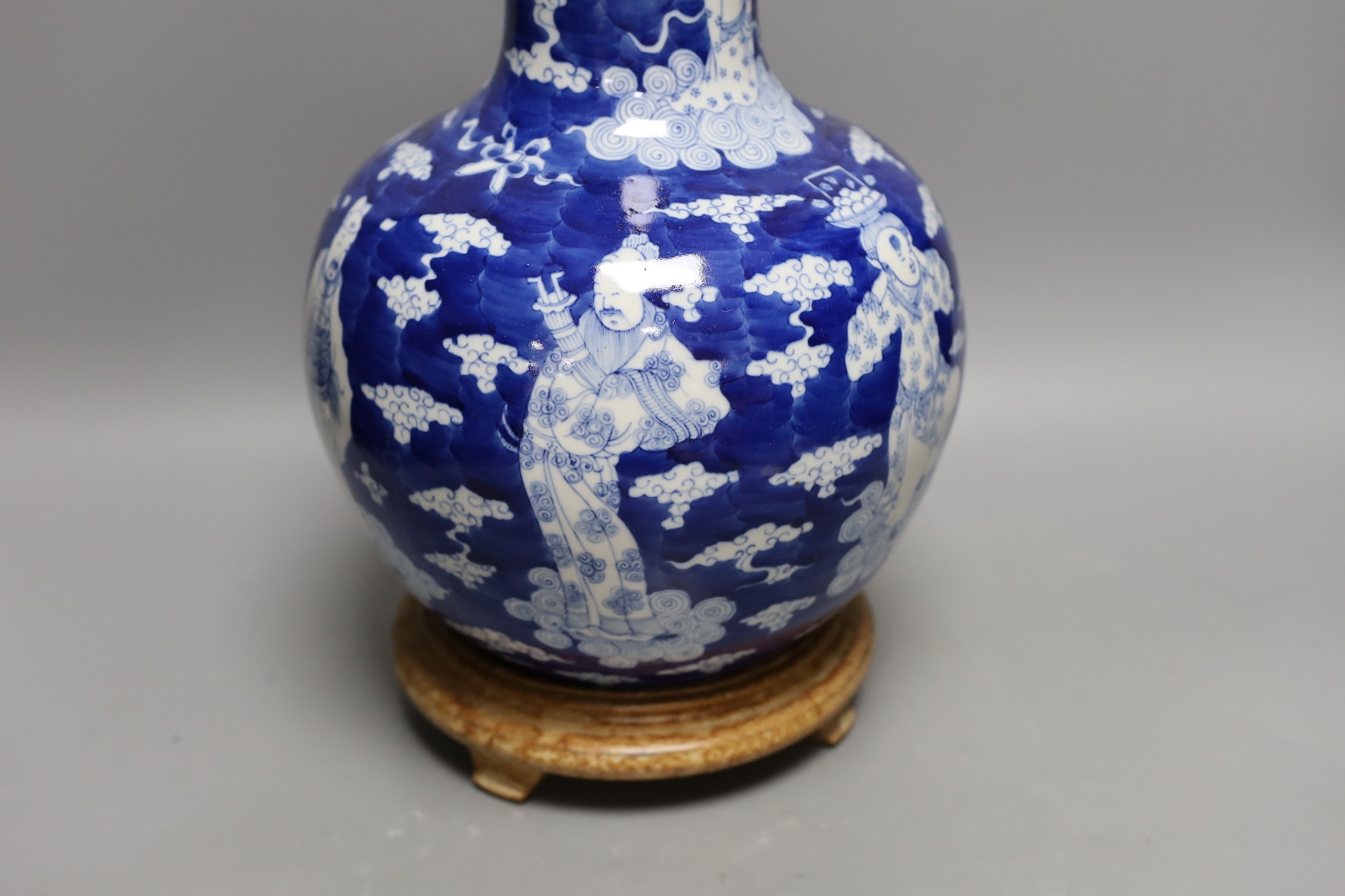 A Chinese blue and white figural vase on hardwood stand, 40cm total height